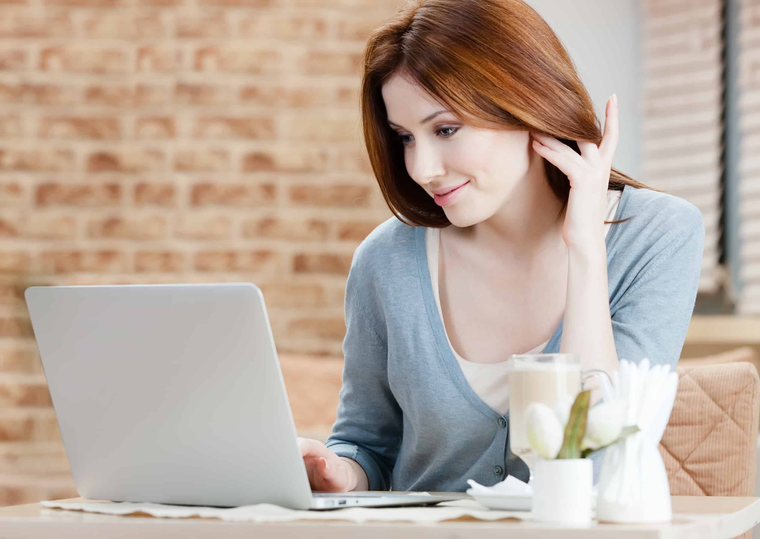 Woman searching the web on laptop