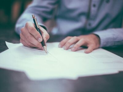 man proofreading documents
